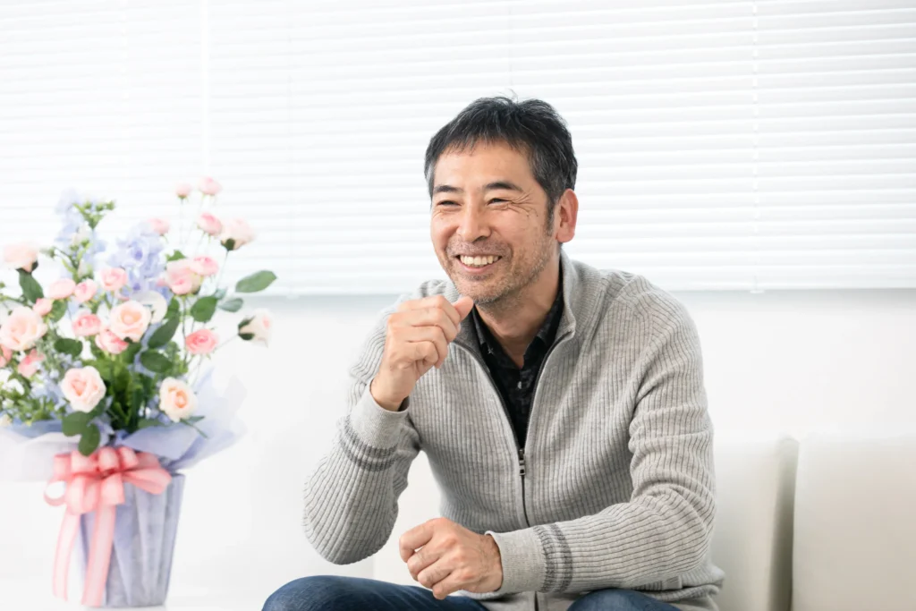 笑顔でインタビューに答える代表の今田様_株式会社イマダのコンサルティング事例